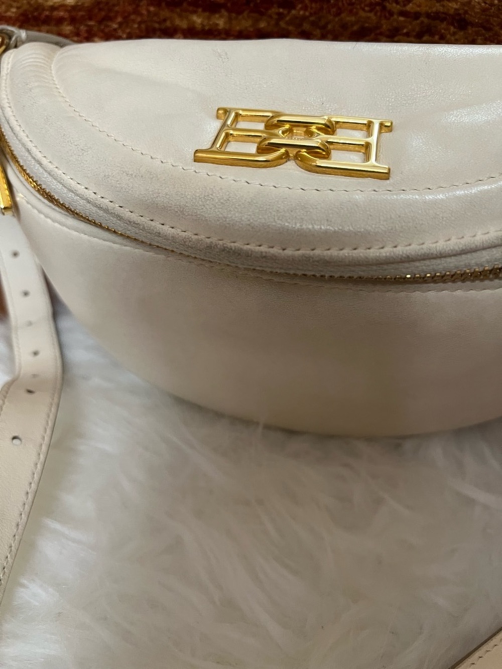 Bally Cream Leather Crescent Crossbody with Gold Logo.